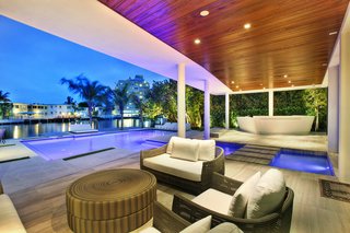 Modern Masterpiece with Views of Miami Beach: Designed by Borges & Associates in collaboration with Laszlo Fazekas and LF Development, this modern masterpiece features soaring ceilings, beautiful water views, and fully-gated privacy. Find unrivaled tropical living in the heart of Miami Beach. Presented by ONE Sotheby's International Realty.