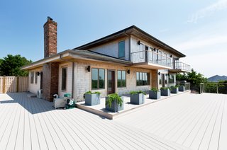 Provincetown Contemporary with Mid-Century Flair: Designed by Trevor Pontbriand, this Provincetown contemporary is a rare retreat with state-of-the-art amenities. Grand views of Cape Cod Bay and Wood End Light, and a screening room are among this captivating home's offerings. Presented by Atlantic Bay Sotheby's International Realty.