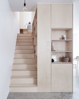 Clean lines, plywood, and ample hidden storage give this home a sleek and contemporary look. 