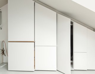 Additional storage was built along one angled wall of the bedroom loft and beneath the skylight.