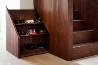 10 Clever Ways to Sneak Storage Into Your Renovation - Photo 9 of 10 - The base of the stairwell includes a hidden compartment to conveniently store shoes.
