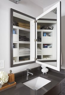 This renovation preserved the depth behind the medicine cabinets for some substantial storage space. 