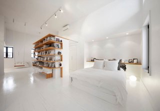 10 Bright and Airy Modern Attic Renovations - Photo 2 of 10 - The architecture firm L. McComber Itée demolished a sloping ceiling in this Montreal attic to create a bright, roomy live-work space.