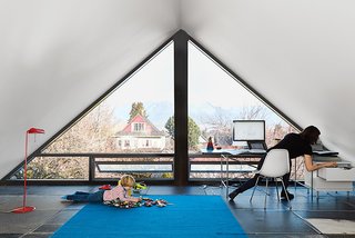 10 Bright and Airy Modern Attic Renovations - Photo 6 of 10 - "The city insisted on no flat roofs, so we couldn’t do a major correction to make a contemporary house, but they didn’t anticipate how we would interpret minimum roof slopes. It’s like a Toblerone box." said the architect, D’Arcy Jones, about the structure.