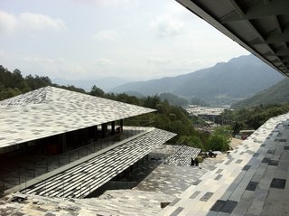 Architect Spotlight: 12 Works by Japanese Architect Kengo Kuma - Photo 8 of 12 - Different kinds of local stones were sourced from a nearby quarry and put together like a mosaic, resulting in an almost pixelated effect. 