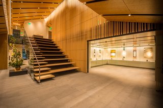 Take a Tour of Kengo Kuma’s Expansion of the Portland Japanese Garden - Photo 2 of 8 - The Jordan Schnitzer Japanese Arts Learning Center is home to new gallery spaces, a multi-purpose classroom, executive offices, a gift shop, and library. The doors of the Learning Center are made with narrow planks of chestnut that are hand-hewn by Japanese workshop Nakamura Komuten, using a special Japanese adze called a "chona." The predominant wood on the interior of the Learning Center—including all of the screens—is Port Orford Cedar, while the ceiling panels are crafted from bamboo. 