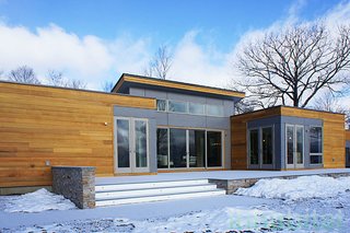 The "Breezehouse" is a 2,420-square-foot prefab home by Blu Homes in the Hudson Valley. The soaring ceilings and open floor plan allow for spacious, light-filled rooms. 