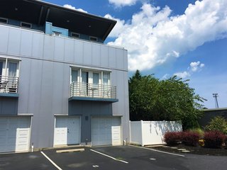 10 Steel Prefabs That Are Both Modern and Practical - Photo 7 of 10 - The Forj Lofts is a minimalist three-story residential loft unit on the Delaware coast. The project was engineered for extreme wind loads. The Forj name is a play on words for an Iron Forge, as there's nothing but steel used for the building components. 