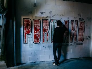 At the DWP Closing Party, Portland State University students painted a mural that attendees collaborated on. 