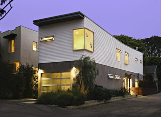 Eco-Friendly Prefabs and the Modern Mobile Home: Spotlight on Jennifer Siegal - Photo 12 of 14 - This 16-foot-wide, four-steel framed module house has been carefully fitted into its 25-by-100-foot narrow lot. The lower floor is clad in light gray trowel stucco and the upper floor has horizontal Hardiplank, a green fiber cement siding.