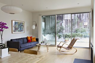 Eco-Friendly Prefabs and the Modern Mobile Home: Spotlight on Jennifer Siegal - Photo 13 of 14 - The first floor contains a bright and airy open living/dining/kitchen space that faces a rear patio with large sliding glass doors. 