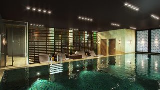 "Communal areas show more industrial elements and concrete walls: the inspiration for this comes from the historic LX Factory in Lisbon." - Design Command. Pictured is the swimming pool. 