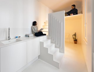 Gestalten's New Book Shows How to Transform Small Spaces Into Design Marvels - Photo 2 of 16 - The Spectral Apartment by Betillon/Dorval-Bory Architects is a renovation of a 215-square-foot flat on the outskirts of Paris. Designed around the need to maximize natural light, the all-white interior features a mezzanine with a stairway leading up to a sleeping nook that conceals the sink and shower below. 