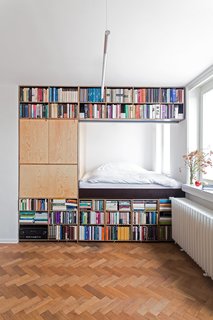 Gestalten's New Book Shows How to Transform Small Spaces Into Design Marvels - Photo 11 of 16 - This renovation for a writer in Prague by BY Architects has slotted the bed behind a massive bookshelf in order to meet spatial requirements. 