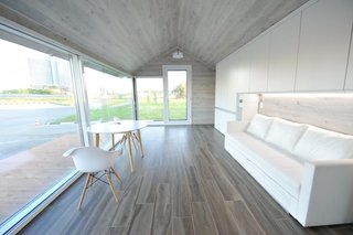 This Zero-Energy Passive Mobile Prefab Was Partially 3D Printed - Photo 3 of 5 - Using a 3D-printing robot to create the walls, roof, and floor, PassivDom's 380-square-foot model can be printed in about eight hours. The rest of the home, including the windows, doors, plumbing, and electrical systems, are then added by hand. 