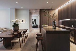 A Look Into NYC's 152 Elizabeth Street, Tadao Ando's First Residential Project Outside of Asia - Photo 3 of 9 - Dinesen wood doors have been designed to seamlessly pocket into corridor walls. When closed, they section off the master bedroom and bath to create a seamless entertaining space. 