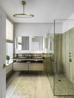 Formerly Home to Superman, The Standish Offers Modernized Beaux-Arts Condos From $1.3 Million - Photo 7 of 8 - The master bath features a rain shower, Fantini fixtures in natural brass, and accents in travertine and mosaic.