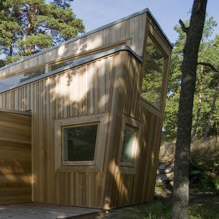 A Look at 10 Minimalist Scandinavian Cabins - Photo 8 of 10 - Built entirely of wood, this cabin in the forest of Ingarö was constructed in close collaboration with local builders and local woodworking companies—and was inspired by its sylvan setting. 