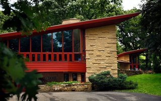 10 Frank Lloyd Wright Homes Available to Rent Right Now - Photo 7 of 10 - The uniquely large Elam House is a Usonian Home located in southern Minnesota and is one of only 13 Wright homes in the state. Built in 1951, the home features five bedrooms, six bathrooms, three floor-to-ceiling fireplaces, two living rooms with soaring ceilings, a cantilevered balcony, over 100 windows, rare white cypress wood and massive limestone piers, and stonework comparable to Wright's home Taliesin East. Guests can book a stay at the one-bedroom guest house on the property and enjoy private tours of the main house. 