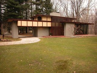 10 Frank Lloyd Wright Homes Available to Rent Right Now - Photo 4 of 10 - Each home that Wright designed was unique to its circumstances, and the Penfield House was no exception. Set on 30 acres in Lake County, Ohio, Wright designed the house in the 1950s with taller ceilings than the other Usonians had, and an elongated profile to accommodate his client Louis Penfield—who was six foot eight.