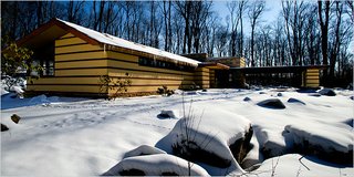 10 Frank Lloyd Wright Homes Available to Rent Right Now - Photo 9 of 10 - Built in 1957, this Wright-designed home was saved and dismantled at its original location in Illinois and relocated to its current location in Acme, Pennsylvania—only 30 minutes from the iconic Fallingwater. The Duncan House shares the 100-acre Polymath Park with three other homes for rent, designed by Wright’s apprentices.