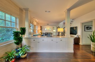 On the Market For $4.5M, This Venice Beach Compound Captures the Essence of Indoor-Outdoor Living - Photo 4 of 8 - Douglas Fir flooring and custom wainscoting and cabinetry have been utilized throughout the main house. 