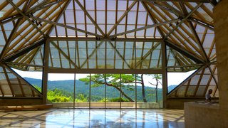 Located in the hilly and forested mountainside outside of Kyoto, the Miho Museum was designed to evoke traditional Japanese architecture. Pei was commissioned by Mihoko Koyama and her daughter Hiroko Koyama to design the structure, which is approximately three-quarters underground. The roof is a large glass-and-steel construction that's composed of translucent triangles, while the exterior and interior walls and floor are made of a beige-colored limestone from France—the exact same material used by Pei in the reception hall of the Louvre.