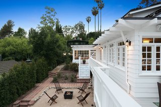 With an Architectural Pedigree and Green Certification, This Pasadena Home Just Listed For $3.6M - Photo 7 of 10 - There are numerous outdoor areas perfect for enjoying Southern Californian indoor-outdoor living. These include the restored front porch, an expansive wrap-around deck (which is original and one of the first built in Pasadena), and a covered patio. Off the patio there is an additional finished room which could be used as a studio. 