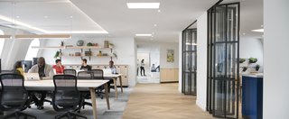 Take a Peek Inside Airbnb's New Loft-Inspired Office Space in Paris - Photo 7 of 13 - Hosting and inviting guests is a priority for the local team and the hospitality lounge was designed with that purpose in mind, functioning as a multipurpose event space that's flexible and able to accommodate various group sizes and needs. Named "Le Nid," the space will be open to the public for monthly events hosted by the local team, including meetups around destinations, debates on travel trends, and exclusive Experiences.