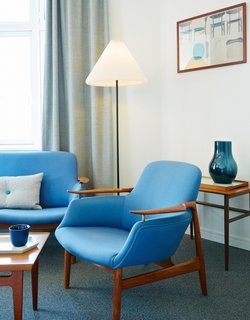 Get Your Fix of Midcentury Scandinavian Design at This Copenhagen Hotel - Photo 6 of 8 - The Finn Juhl Deluxe Room boasts a Finn Juhl NV 53 Chair and NV 53 Sofa.