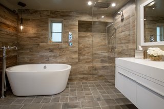 Just Listed at $4M, This Spanish Colonial Revival in Southern California Promises Resort-Like Living - Photo 5 of 8 - The guest quarters' renovations include updated bathrooms features such as a floating Gessi vanity. 