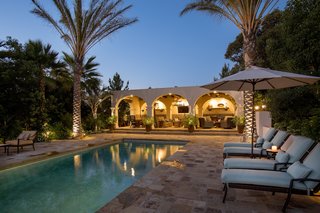 Just Listed at $4M, This Spanish Colonial Revival in Southern California Promises Resort-Like Living - Photo 7 of 8 - The most breathtaking features of Casa Comodoro are the custom pool and loggia area designed by Marc Appleton and Paul Williger. The architects have truly mastered the integration of the original architecture with modern updates and have created a space perfect for enjoying Southern Californian outdoor entertaining. The great room opens to an outdoor loggia and private courtyard on the other side of the home.