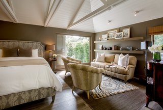 Just Listed at $4M, This Spanish Colonial Revival in Southern California Promises Resort-Like Living - Photo 4 of 8 - The original horse barn has been renovated and converted into a modern and private guest home. 