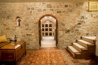 Just Listed at $4M, This Spanish Colonial Revival in Southern California Promises Resort-Like Living - Photo 8 of 8 - The wine cellar was formerly a speakeasy. Crafted from imported Italian brick, it has a 360-bottle capacity and features a completely dedicated thermostat and humidifier with a hand-forged, 1000-pound custom door. 