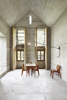 A New Book Examines the Art of Breathing Life Into Forgotten Architecture - Photo 14 of 16 - This Swiss summerhouse is firmly set in the present while being considerate of the structure's 200-year-old past. To preserve the original stone house, Buchner Bründler Architekten created a new concrete one inside of it. 