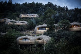 Take an Eco-Escape to a Spherical Forest Villa in an Eroded Volcanic Cone in Rwanda - Photo 9 of 10 - The spherical, thatched structures echo the thousands of hills that dot the Rwandan countryside.