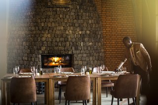 Take an Eco-Escape to a Spherical Forest Villa in an Eroded Volcanic Cone in Rwanda - Photo 7 of 10 - The dining area