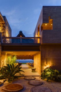 This Expansive Beachside Home on Mexico's Pacific Coast Puts a Modern Spin on Tradition - Photo 2 of 13 - The home features a stunning view of a private beach.