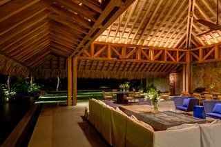 This Expansive Beachside Home on Mexico's Pacific Coast Puts a Modern Spin on Tradition - Photo 4 of 13 - The living/dining area is in a palapa made of natural parota wood, which is over 33 feet high.