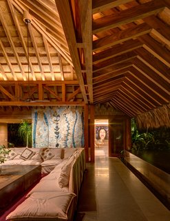 This Expansive Beachside Home on Mexico's Pacific Coast Puts a Modern Spin on Tradition - Photo 5 of 13 - The traditional thatched roof has been given a contemporary spin. 