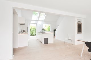 Modern Kitchen Upgrade Ideas From a Danish Design Firm That's Challenging the Kitchen Market - Photo 5 of 8 - For this bright and airy contemporary home in Charlottenlund, Denmark, this design by Henning Larsen Architects was spray-painted white with metal bands painted in the same color and paired with oak countertops. 