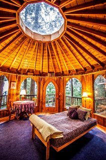 8 Unique Vacation Rentals Around the World - Photo 2 of 16 - The rotunda bedroom features a skylight and a distinctly Pacific Northwest forest vibe. 
