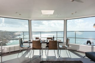 8 Unique Vacation Rentals Around the World - Photo 14 of 16 - The dining room and living room area in the top observation deck. 
