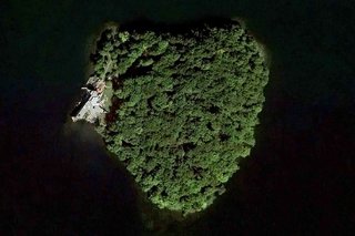 A Home on a Private Island That's Based on a Frank Lloyd Wright Design Is on the Market For $14.9M - Photo 13 of 14 - An aerial view of the heart-shaped island.