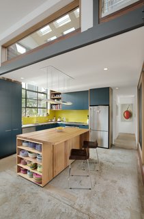 A 1960s Melbourne Warehouse Is Upcycled and Transformed Into an Energy-Efficient Family Home - Photo 3 of 11 - The open kitchen features custom cabinetry and a recycled timber island. 