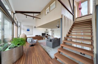 A 1960s Melbourne Warehouse Is Upcycled and Transformed Into an Energy-Efficient Family Home - Photo 7 of 11 - The feeling of space and openness is enhanced by carefully placed internal and external glazing, allowing for views in multiple directions.