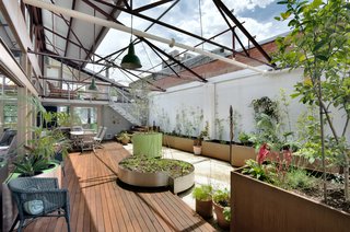 A 1960s Melbourne Warehouse Is Upcycled and Transformed Into an Energy-Efficient Family Home - Photo 9 of 11 - The addition of a north-facing courtyard provides the home with a generous amount of light and heat in winter, while cross-ventilation is achieved through new high-level louvers. 