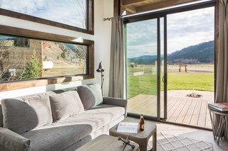 Test Out Tiny House Living at One of These Nature-Immersed Cabin Resorts - Photo 11 of 14 - Sliding doors open to a deck offering incredible views of the local landscape. 