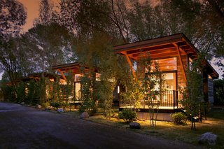 Test Out Tiny House Living at One of These Nature-Immersed Cabin Resorts - Photo 5 of 14 - The Wedge model offers a private deck with a small propane grill and picnic table.