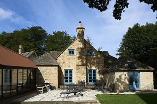Historic Gasworks Cottage With a Modern Cor-Ten Steel Addition Hits the Market - Photo 3 of 9 - The home is arranged around a central courtyard, which creates a smooth connection between the extension and the stone gasworks. 